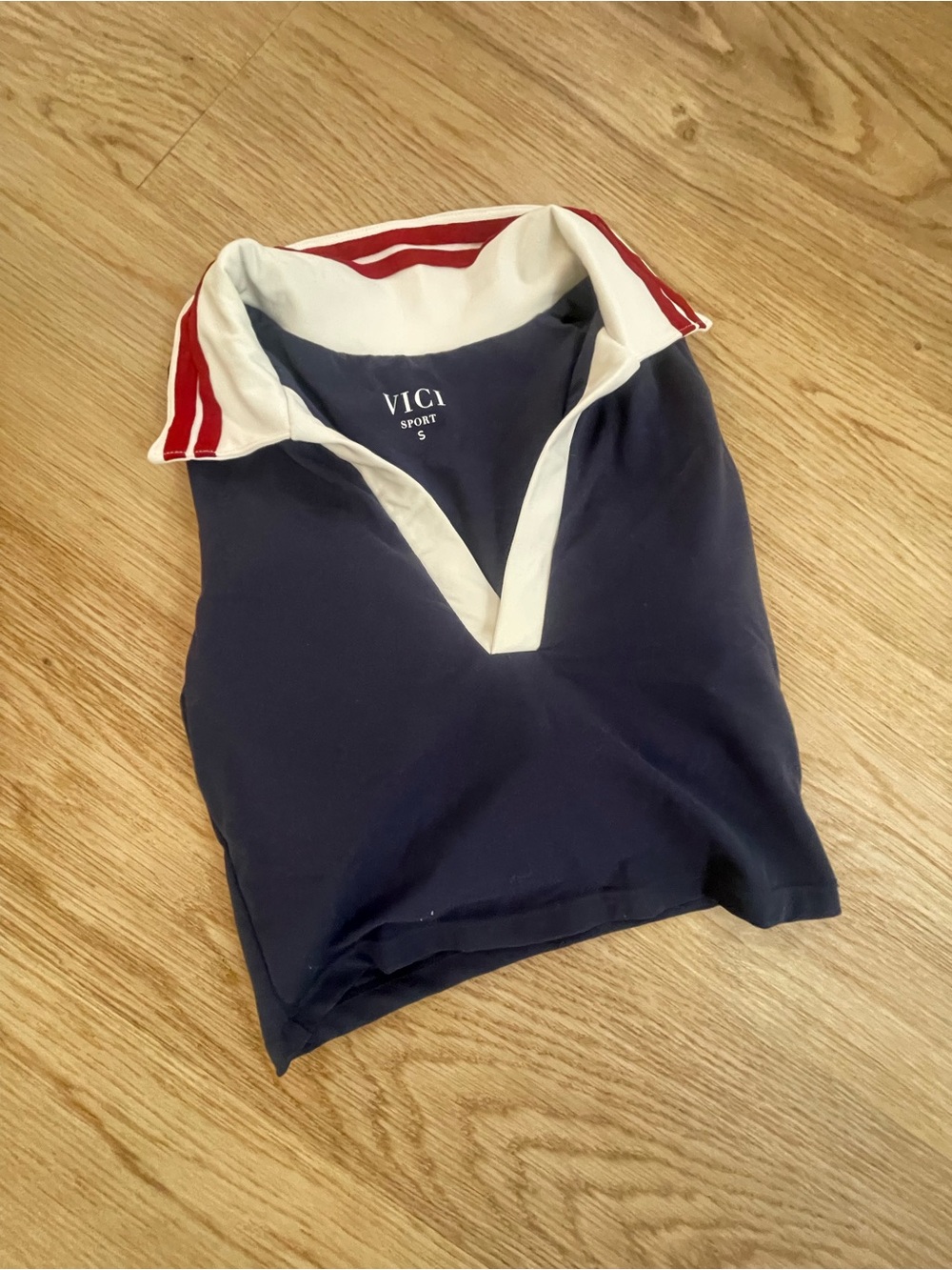 Vici Navy Polo with White V-Placket and Red-Striped Collar